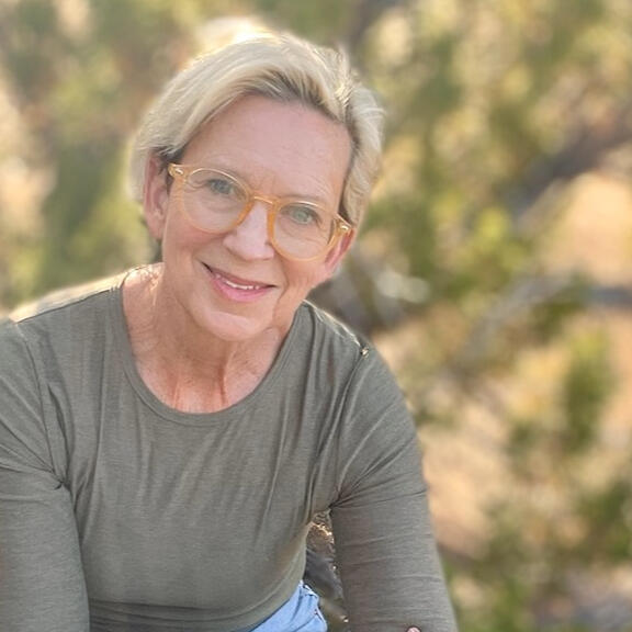 Roxanne Darling, Nature & Forest Therapy Guide portrait of roxanne darling, wearing glasses